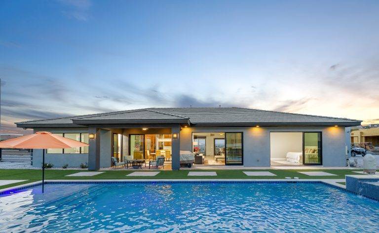 Las Vegas Calico Ridge home backyard with inground swimming pool and hot tub